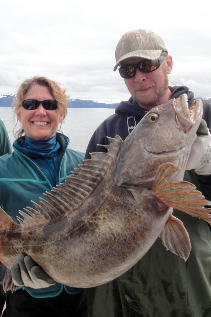 Marie's trophy ling cod pulled up from 720 feet. I brought it into the boat and needed Captain Jim to hold it for the trophy shot before returing it to the sea.